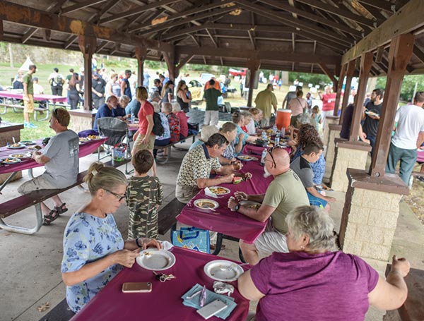 Community engagement - people eating under gazebo