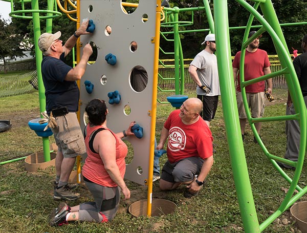 people constructing playground